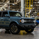 A blue Ford Bronco SUV in the factory